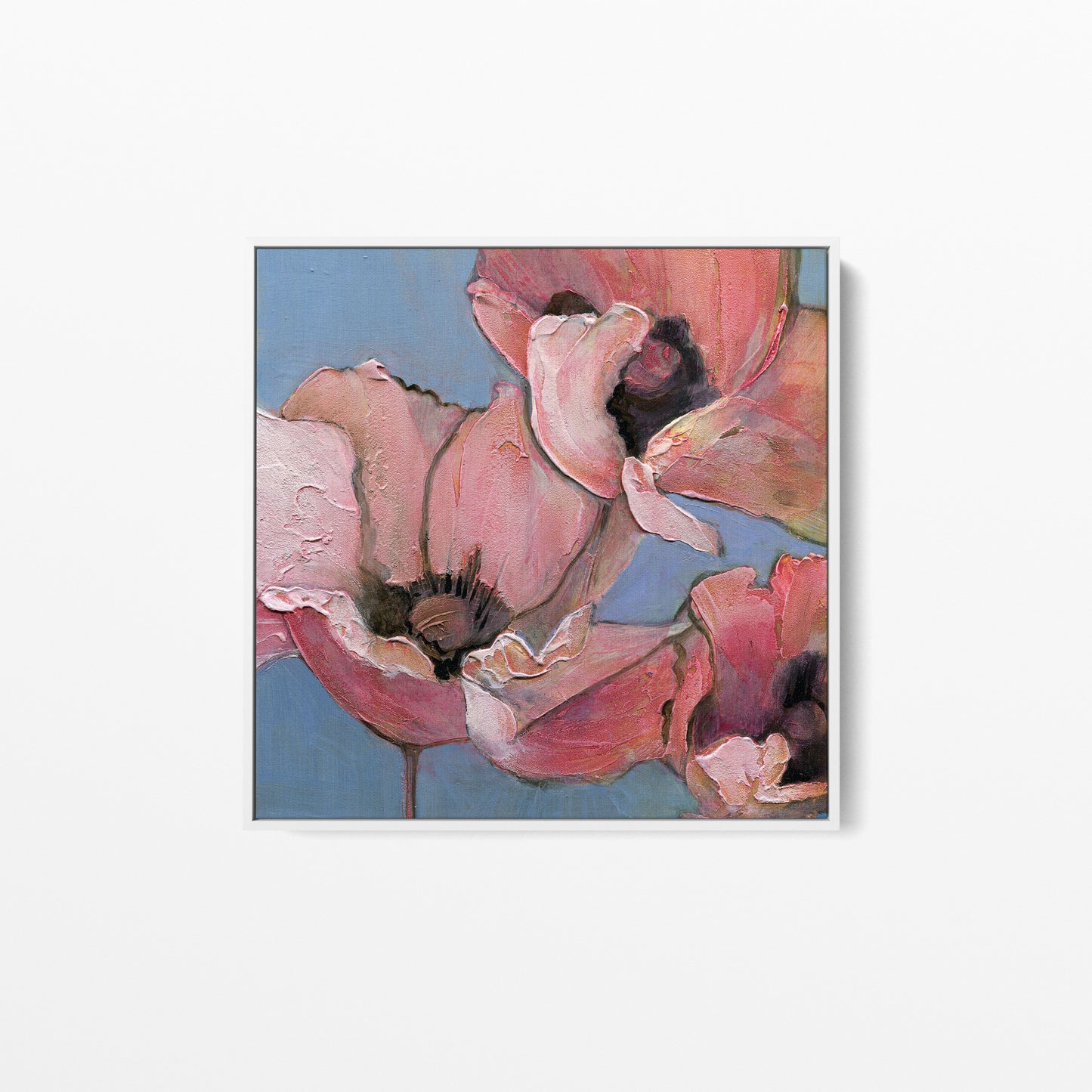 An acrylic painting of poppies in shades of pink, peach, and blue. Framed in a white wood frame.