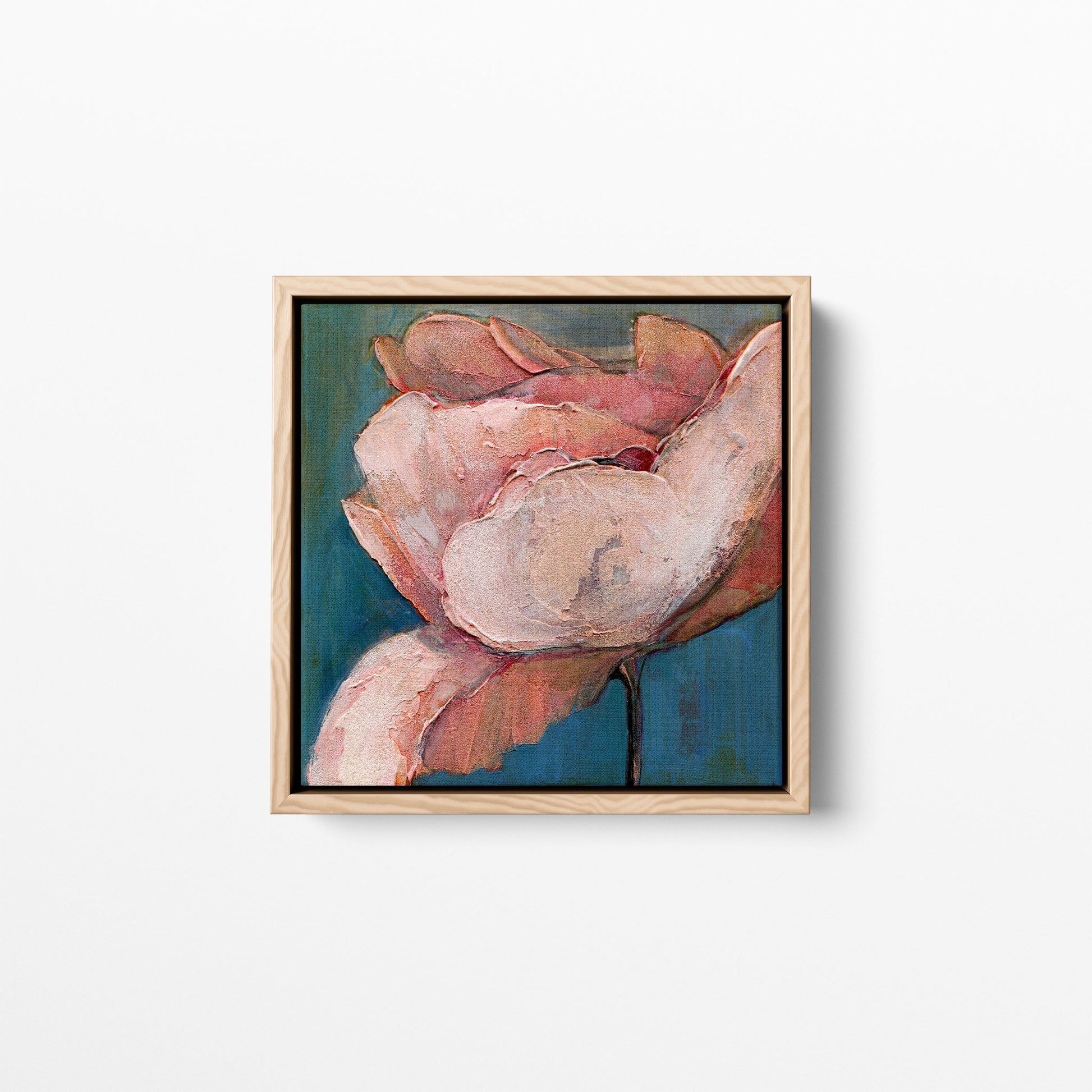 A 12x12 inch print of an acrylic painting of a close-up view of a poppy flower with soft blues and pink/peach hues. Framed in a natural wood frame.