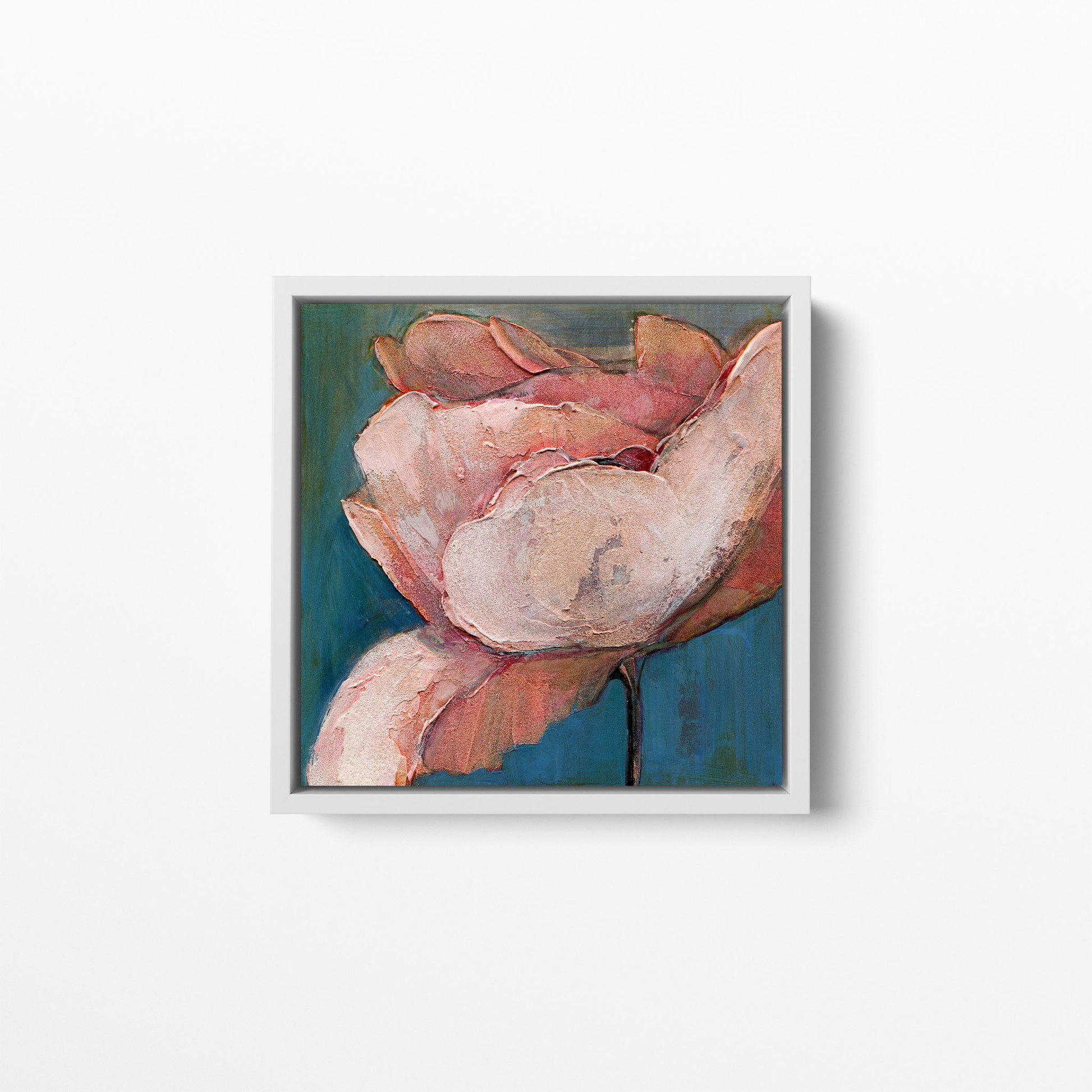 A 12x12 inch print of an acrylic painting of a poppy flower with soft blues and pink/peach hues. Framed in a white wood frame.