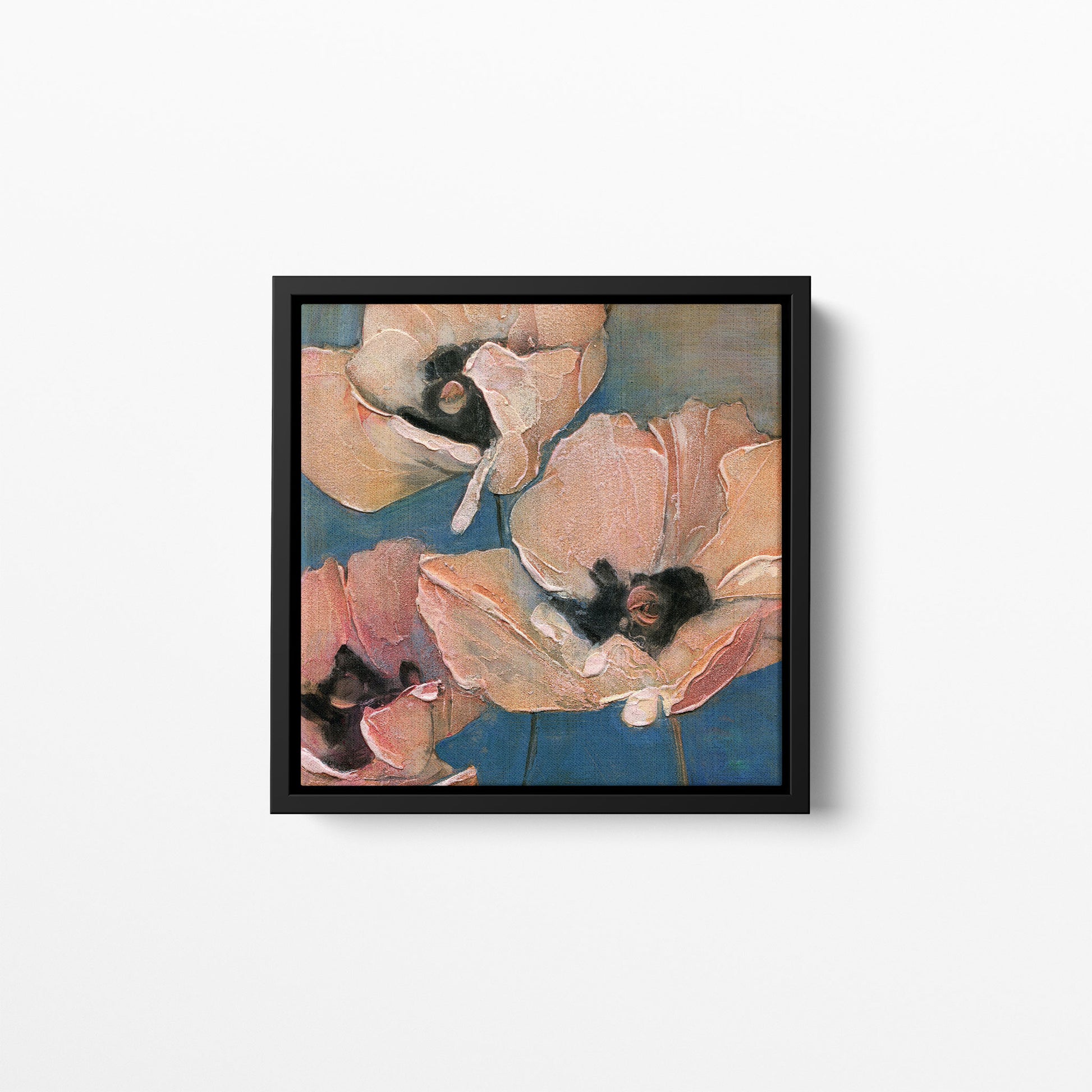 A close-up floral composition art print featuring three pink poppies with textured petals and dark centers against a muted blue background. Framed in a black wood frame.